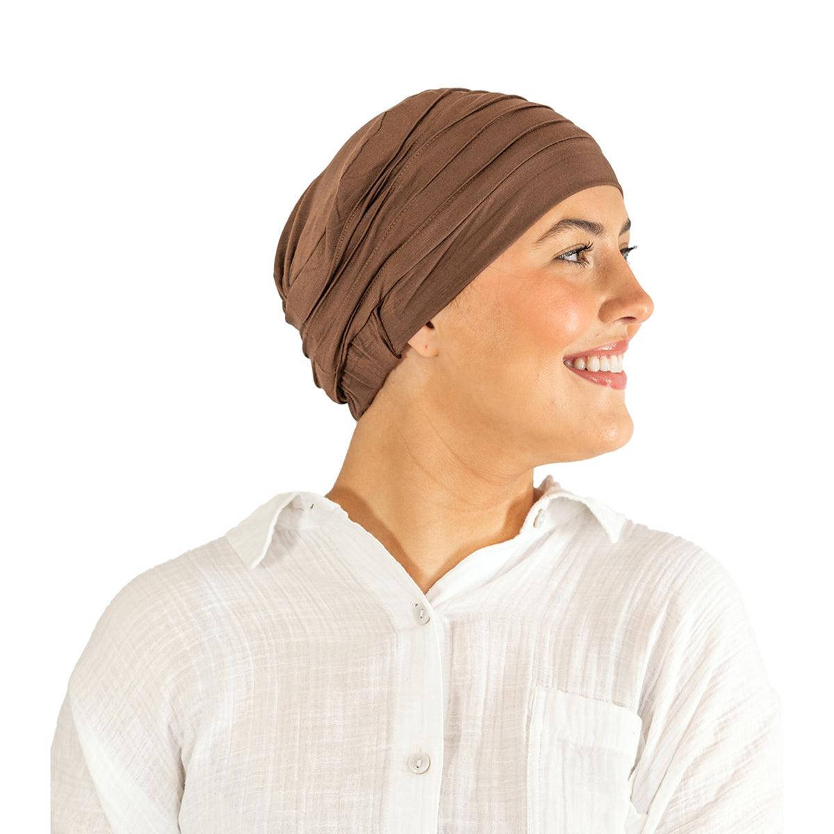 Woman wearing a brown headscarf and white shirt on a white background