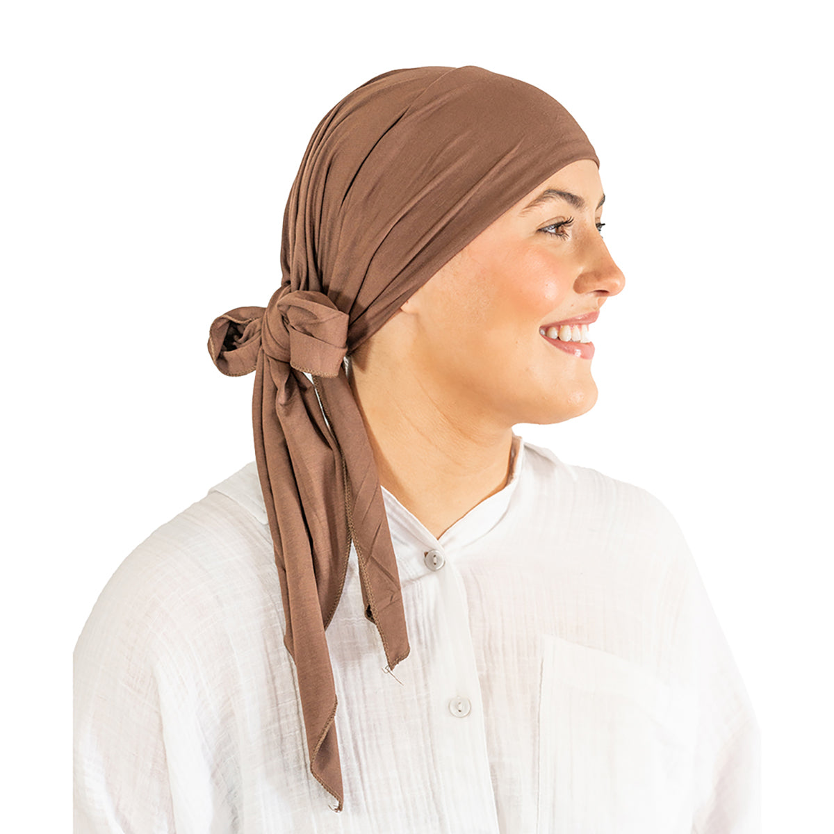 Woman wearing a brown headscarf on a white background