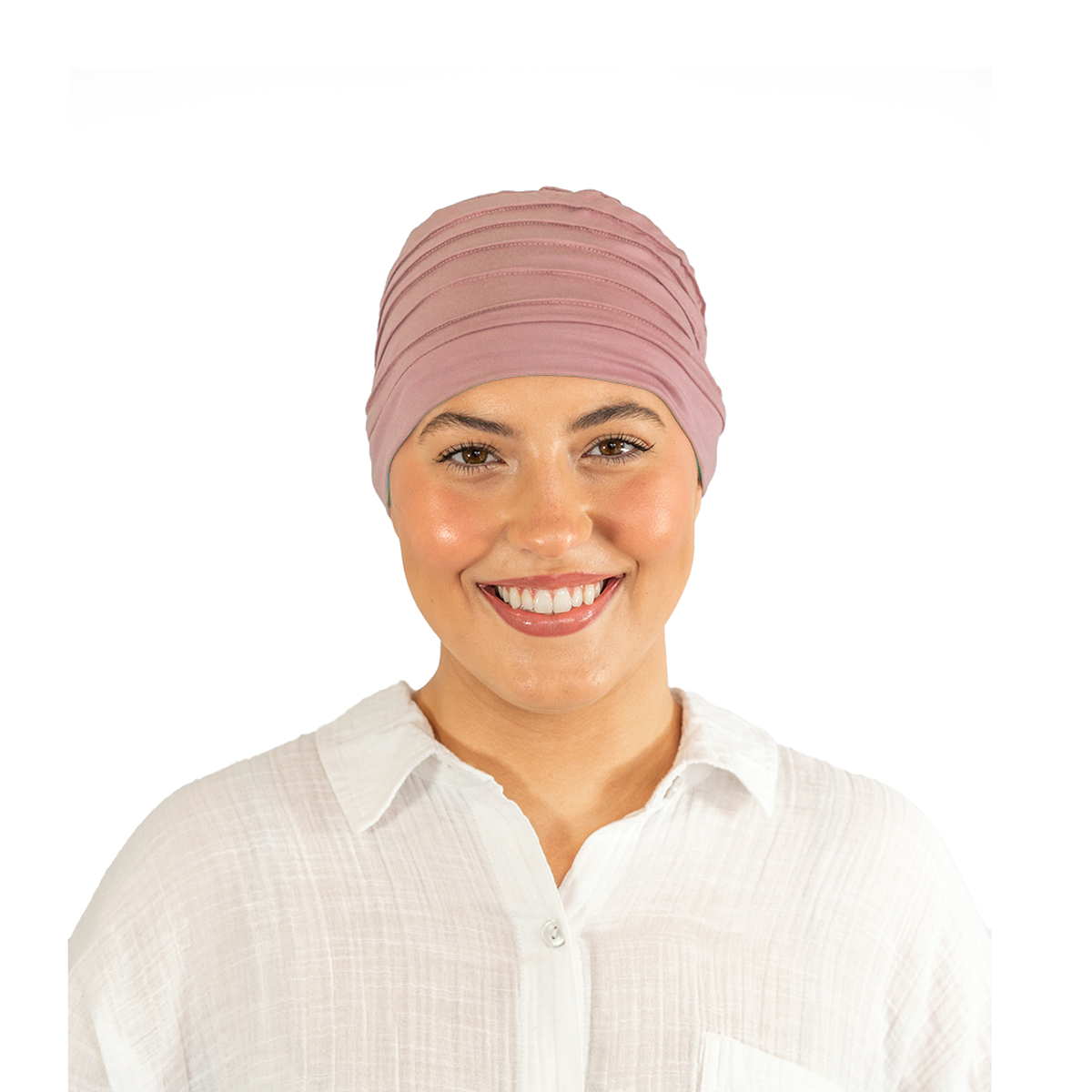 Woman wearing a pink headscarf on a white background