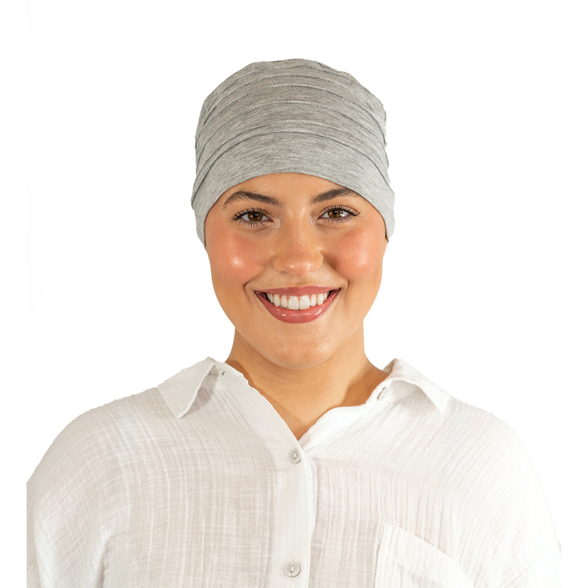 Woman wearing a gray headscarf and white shirt on a white background