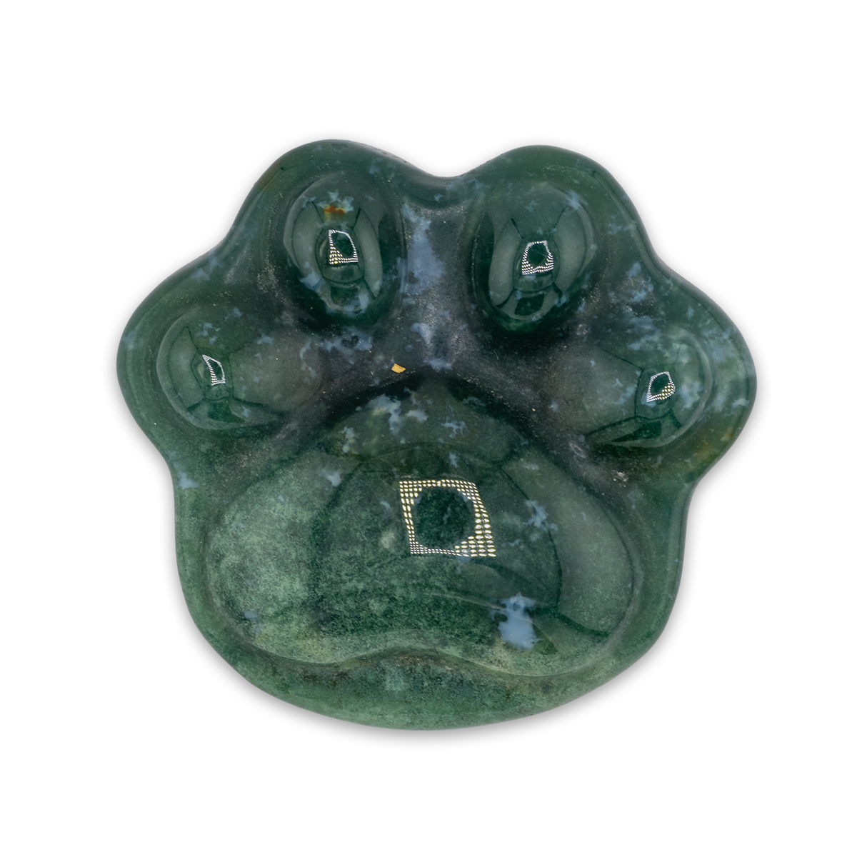Green stone with engraved designs on a white background