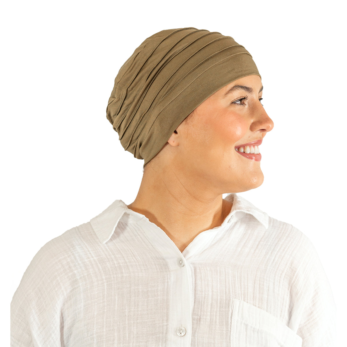 Woman wearing a beige headscarf on a white background