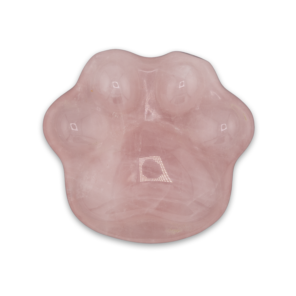 Pink silicone breast implant on a white background