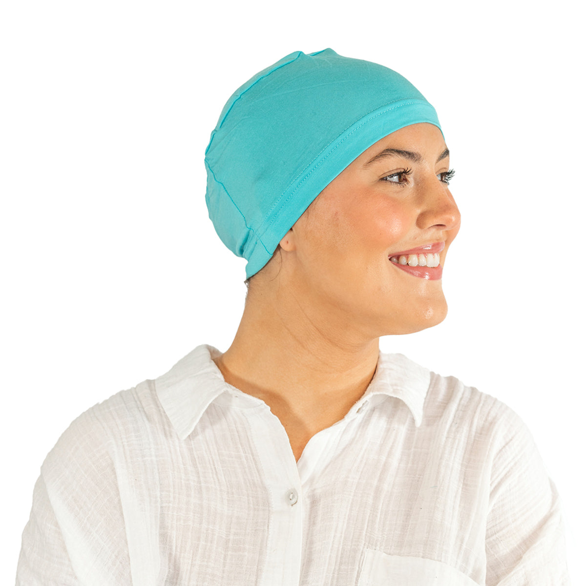 Woman wearing a turquoise headscarf on a white background