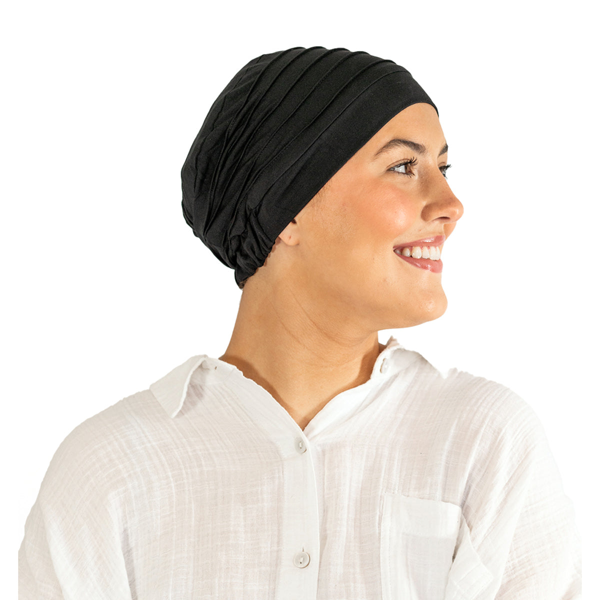 Woman wearing a black headscarf and white shirt on a white background