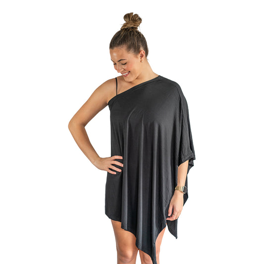 Woman wearing a black one-shoulder dress on a white background