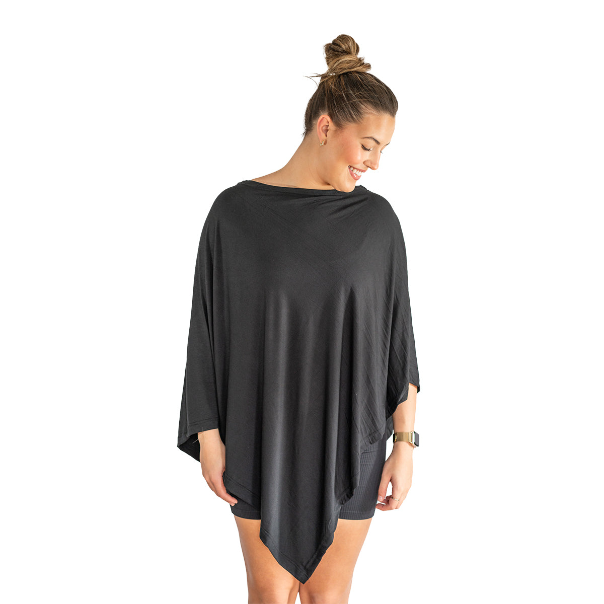 Woman wearing a black oversized shirt on a white background