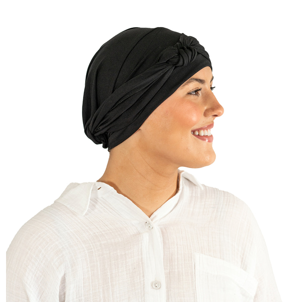 Woman wearing a black headscarf on a white background