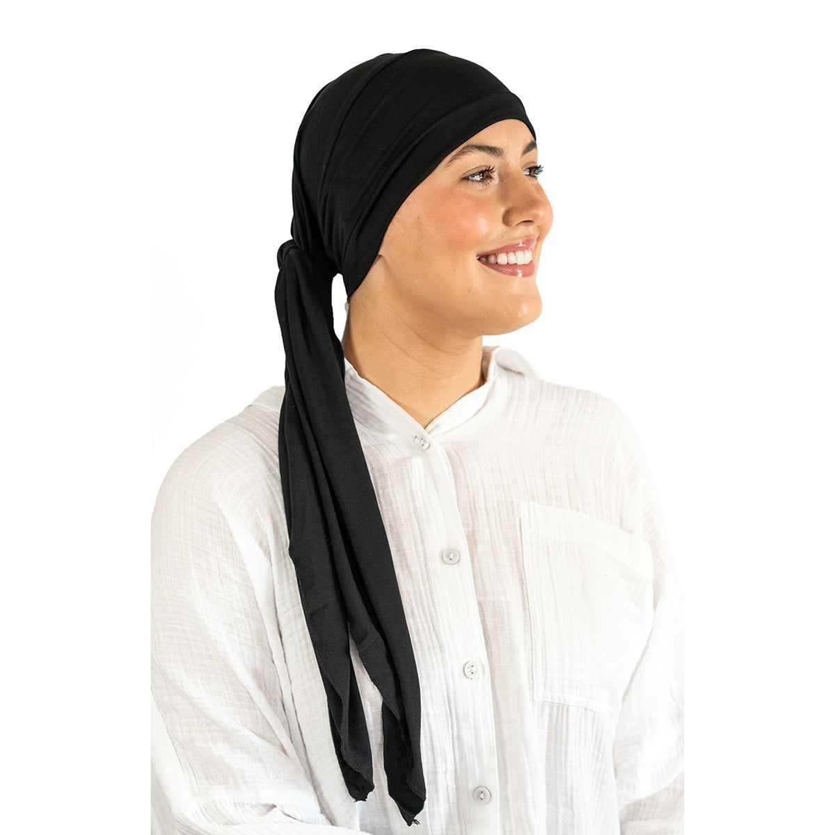 Woman wearing a black headscarf and white shirt on a white background