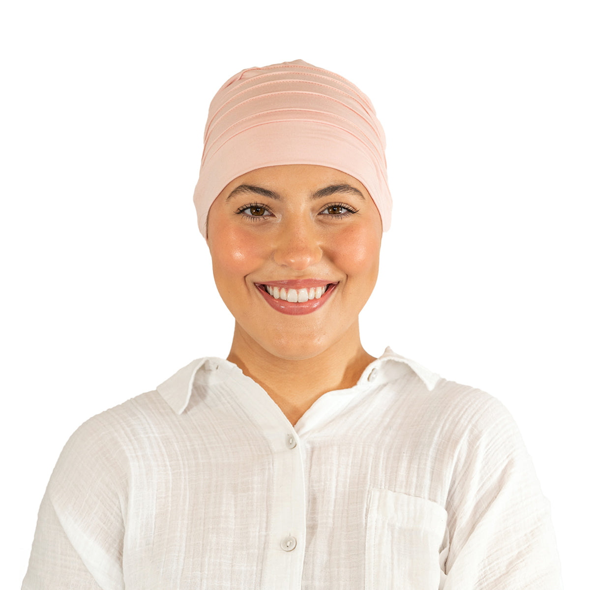 Woman wearing a pink headscarf on a white background
