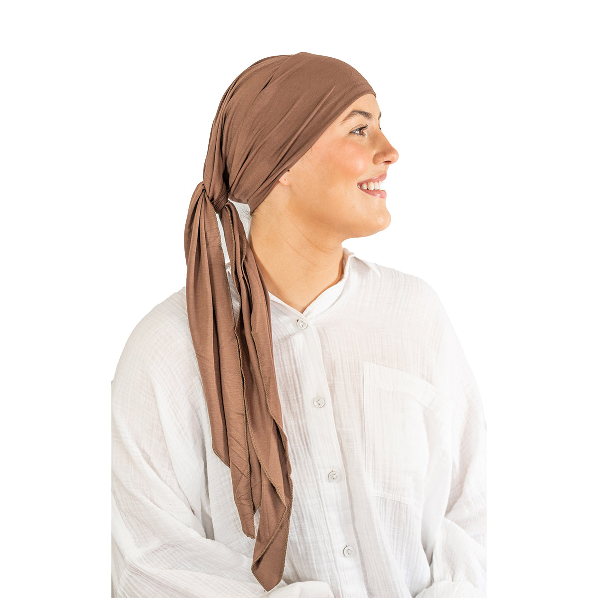 Woman wearing a brown headscarf on a white background