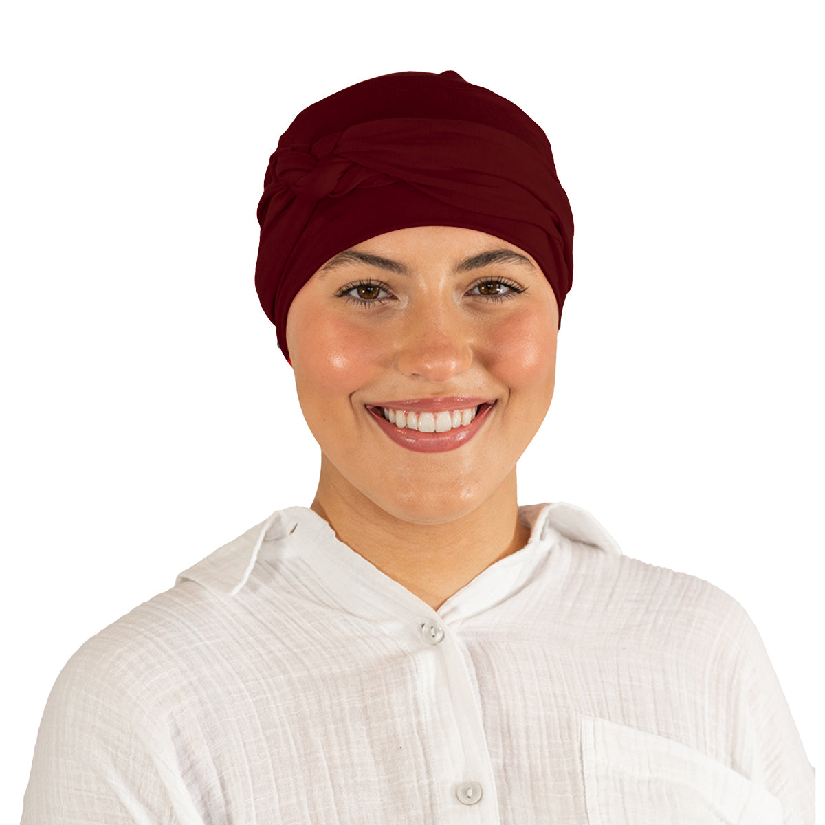 Person wearing a maroon headscarf and white shirt on a white background
