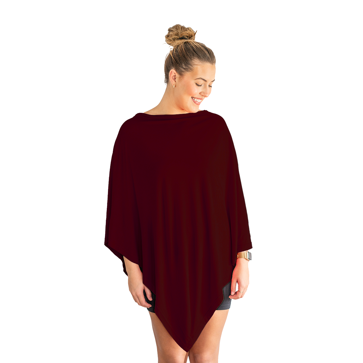 Woman wearing a dark red poncho on a white background