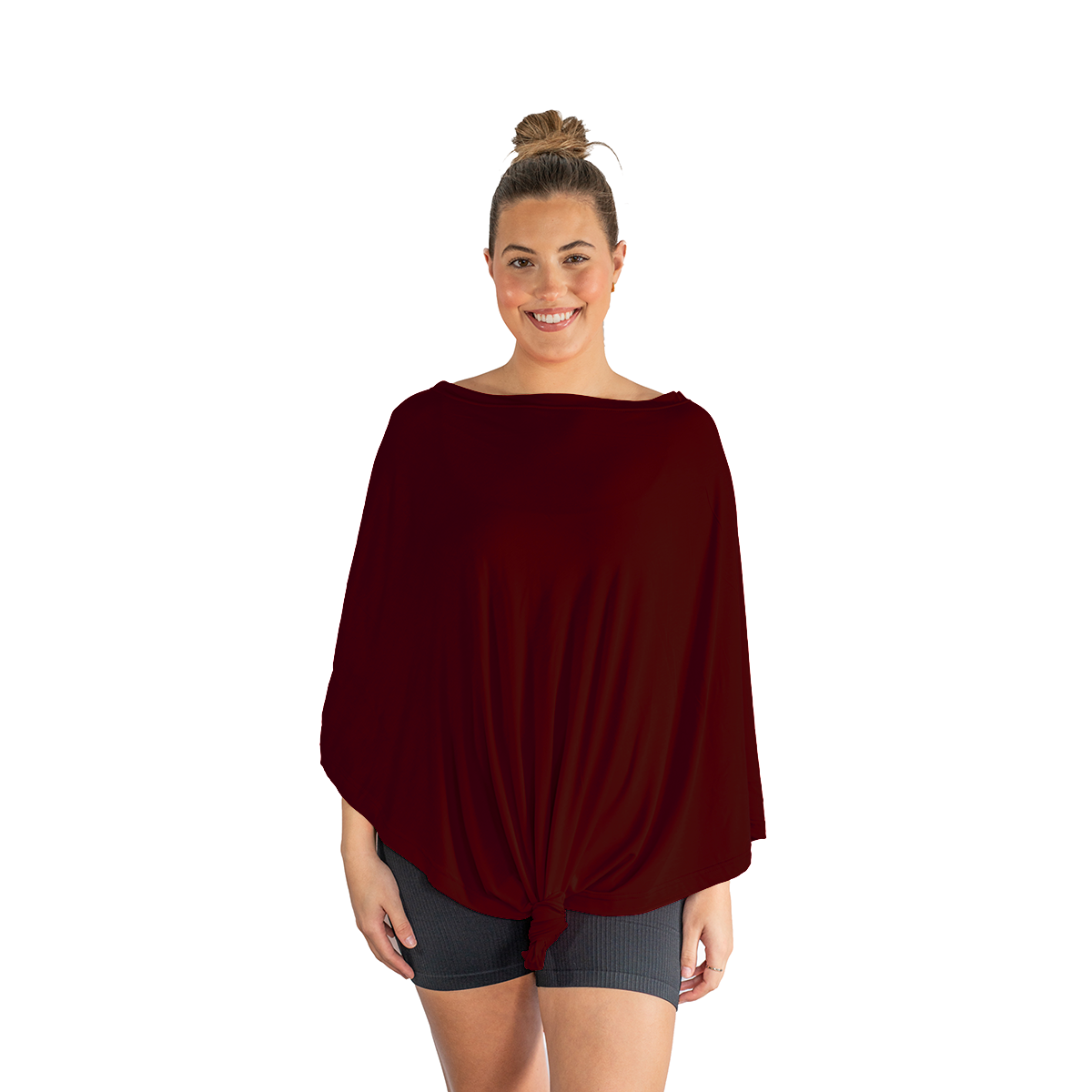 Woman wearing a burgundy poncho on a white background