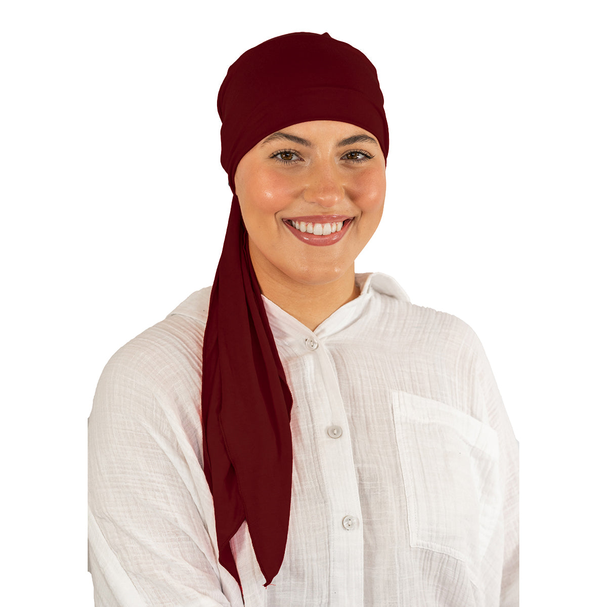 Woman wearing a maroon headscarf on a white background