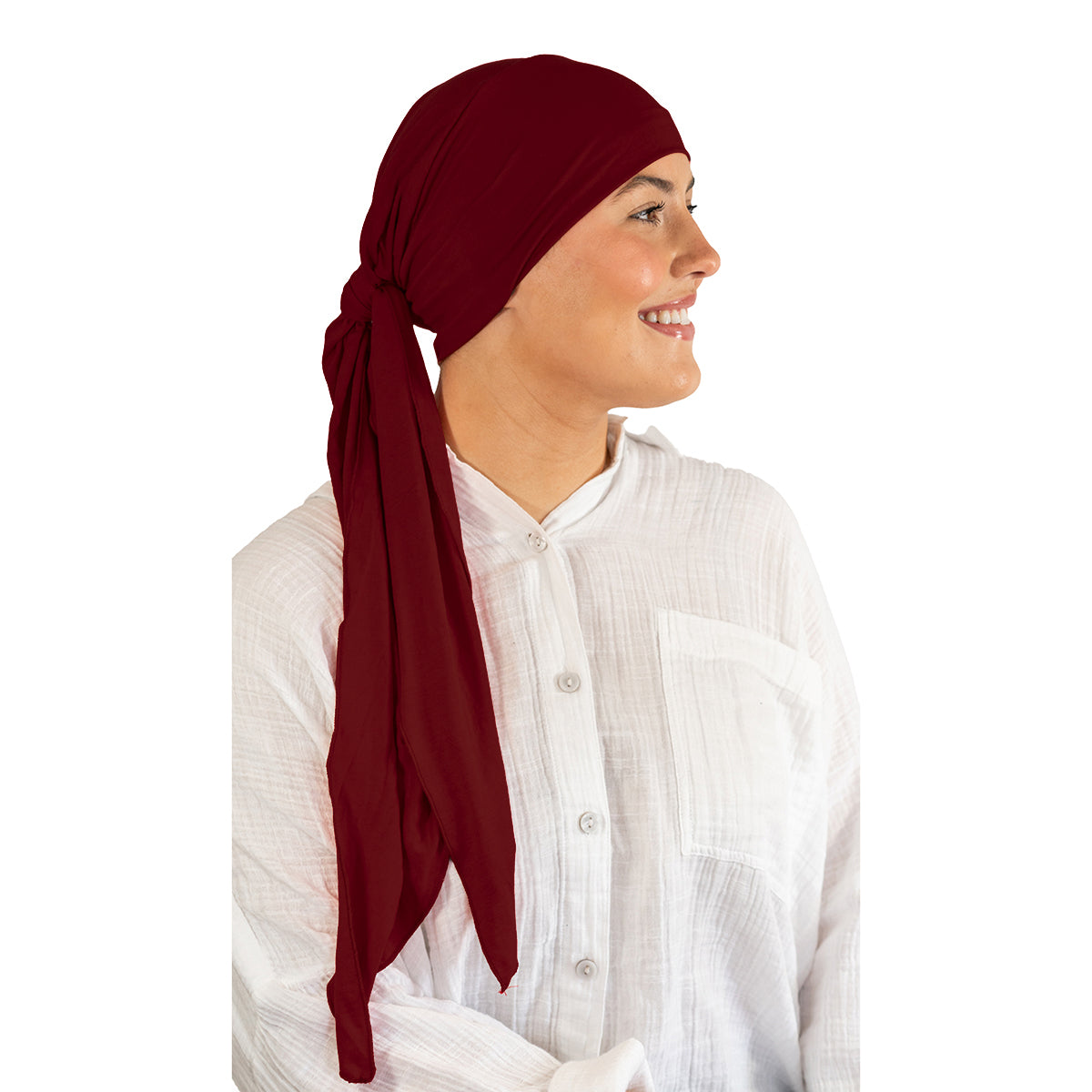 Woman wearing a red headscarf on a white background