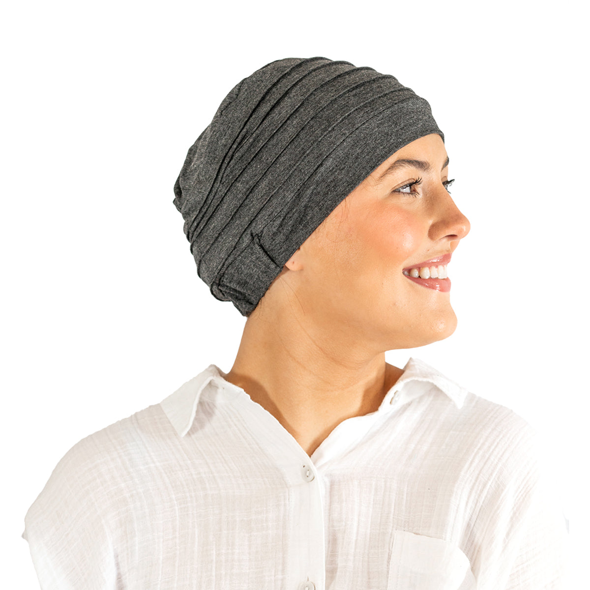 Woman wearing a gray headscarf on a white background