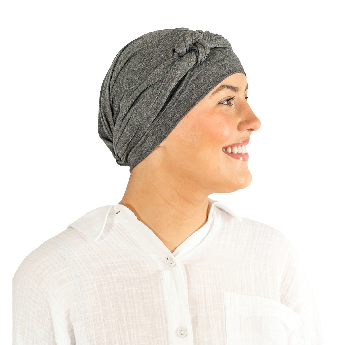 Woman wearing a gray headscarf on a white background