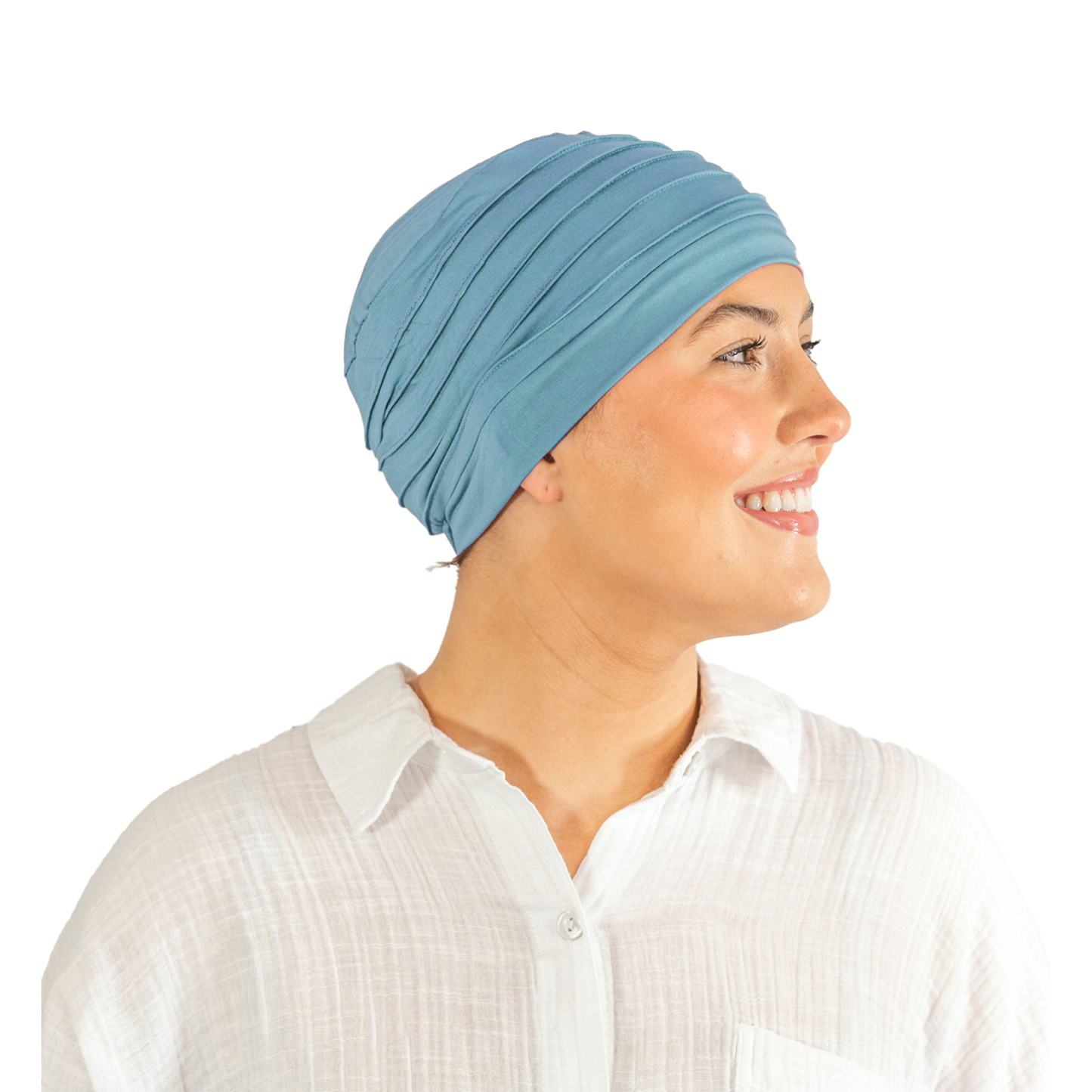 Woman wearing a light blue headscarf on a white background