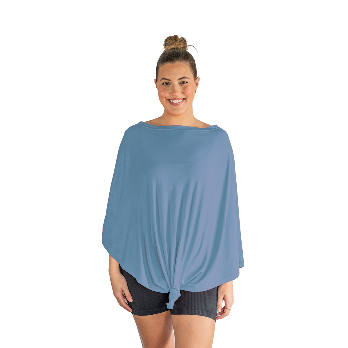 Woman wearing a blue poncho over a black top and shorts on a white background