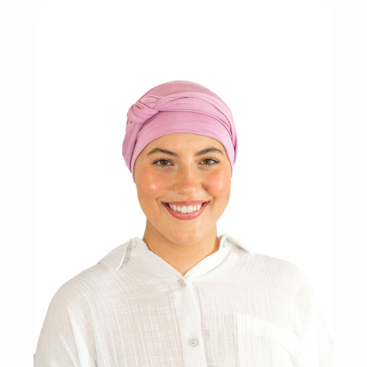 Woman wearing a pink headscarf on a white background