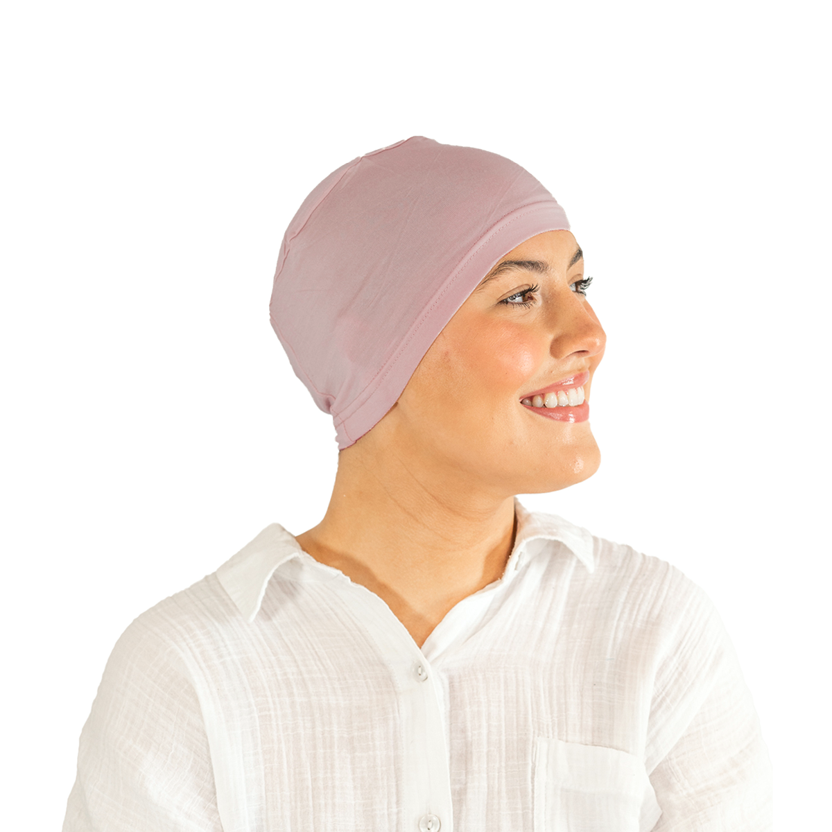 Woman wearing a light pink headscarf on a white background
