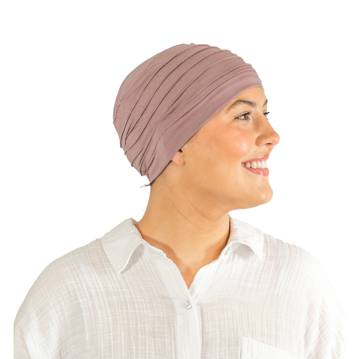 Woman wearing a mauve headscarf on a white background
