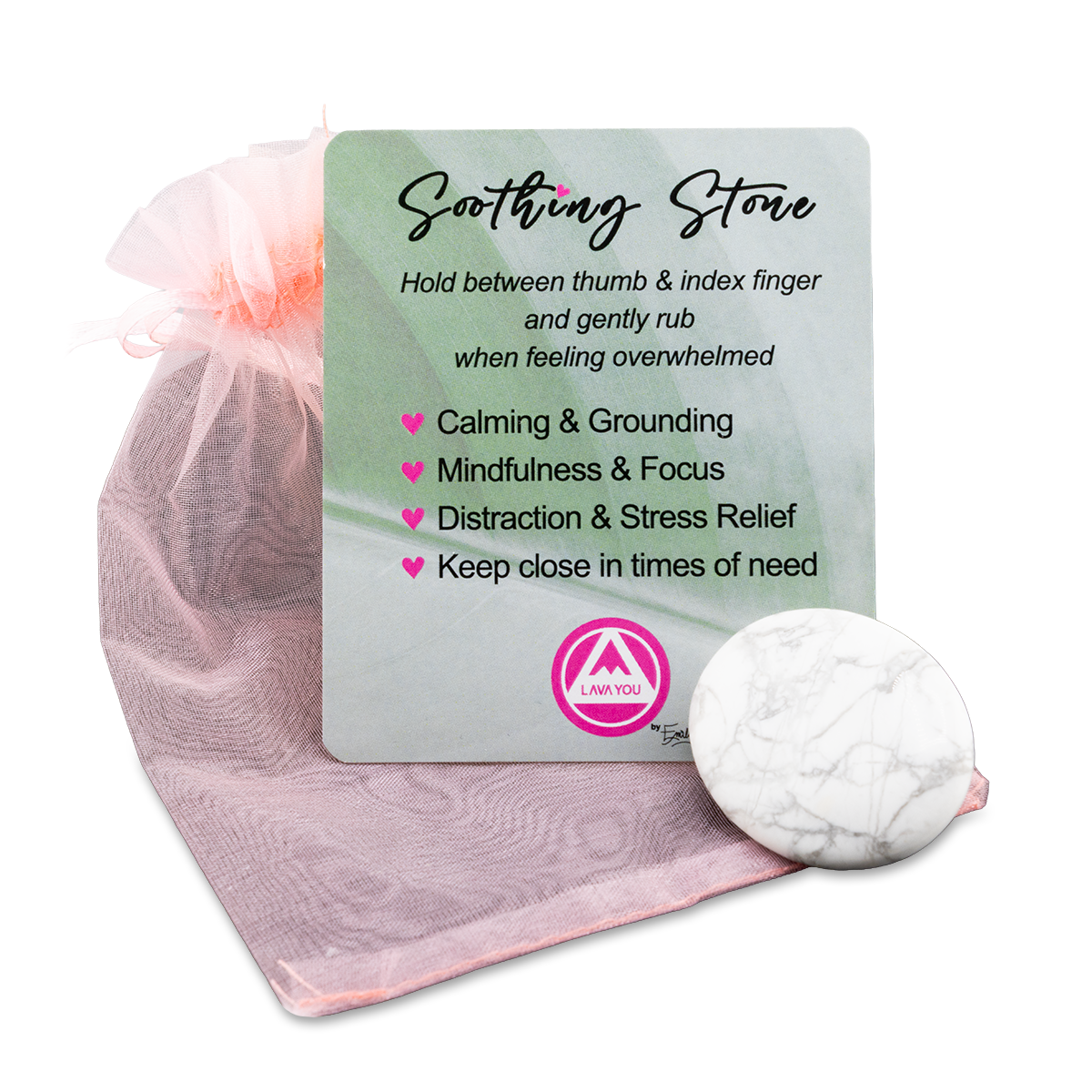 White stone with a card on a pink fabric background