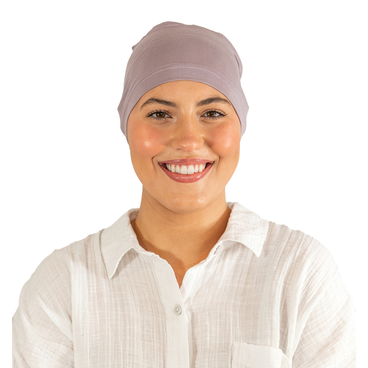 Woman wearing a light purple headscarf on a white background