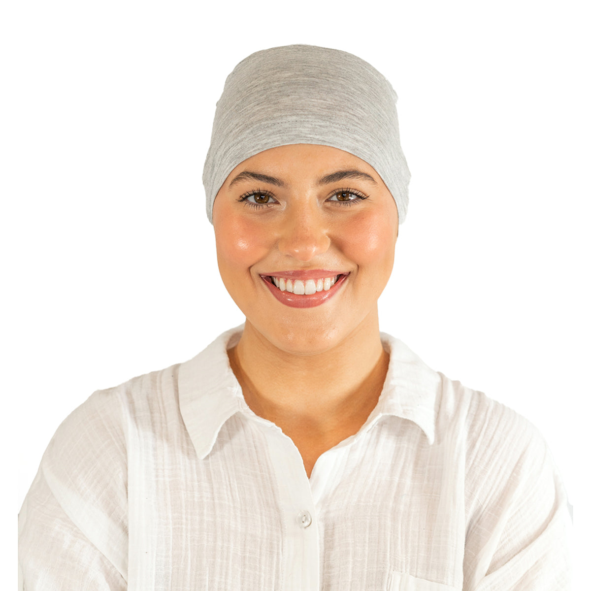 Woman wearing a gray headscarf on a white background