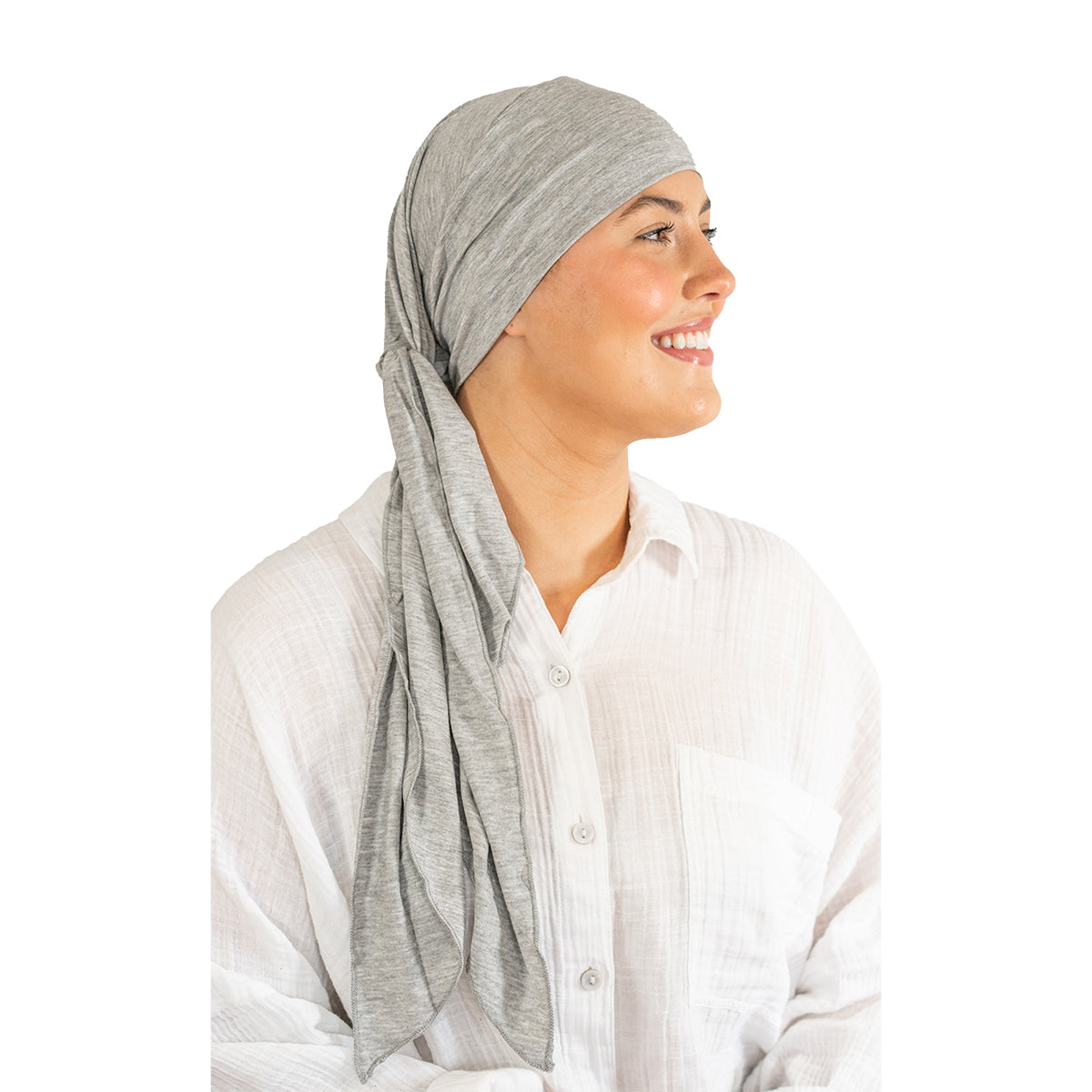 Woman wearing a gray headscarf on a white background