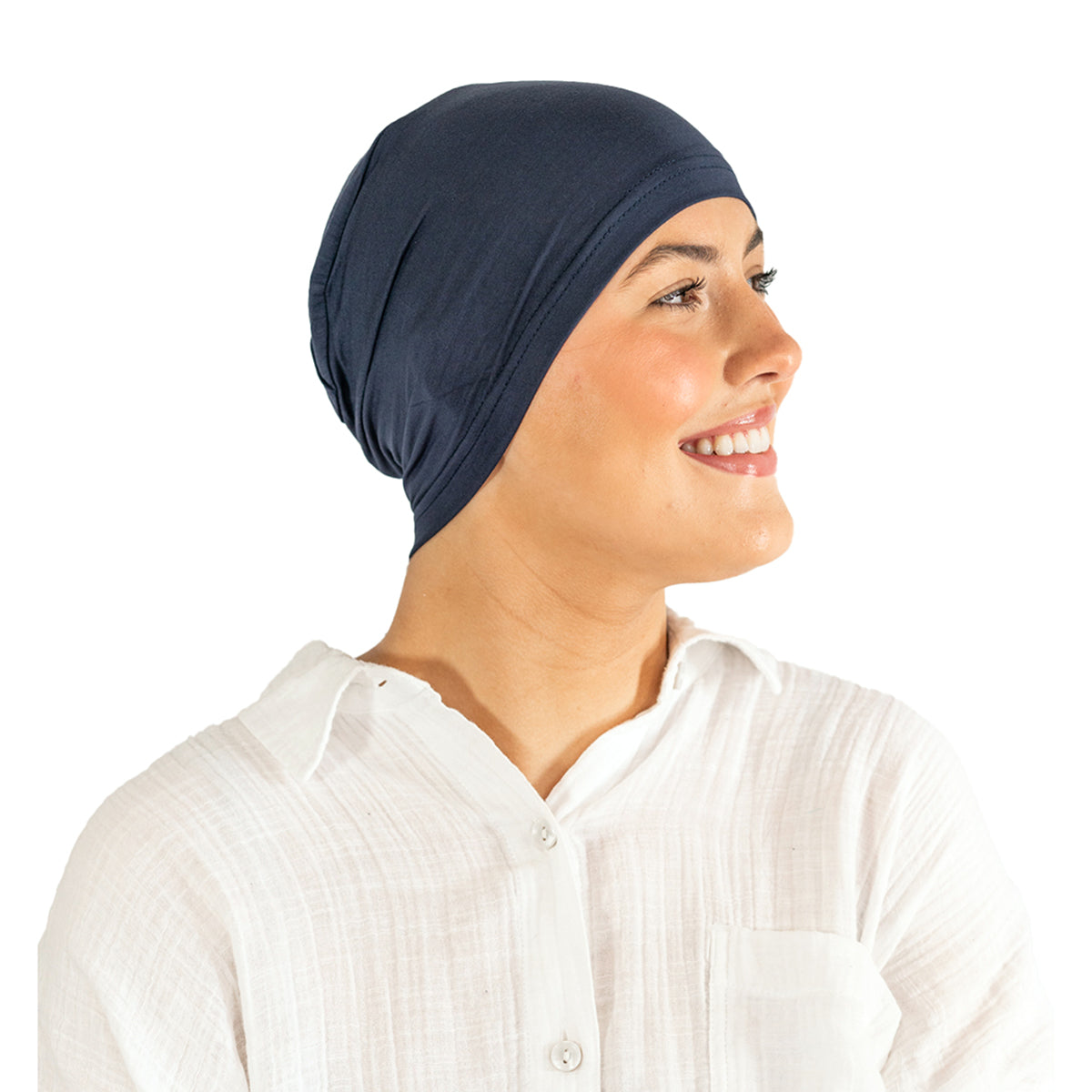 Woman wearing a navy blue headscarf on a white background