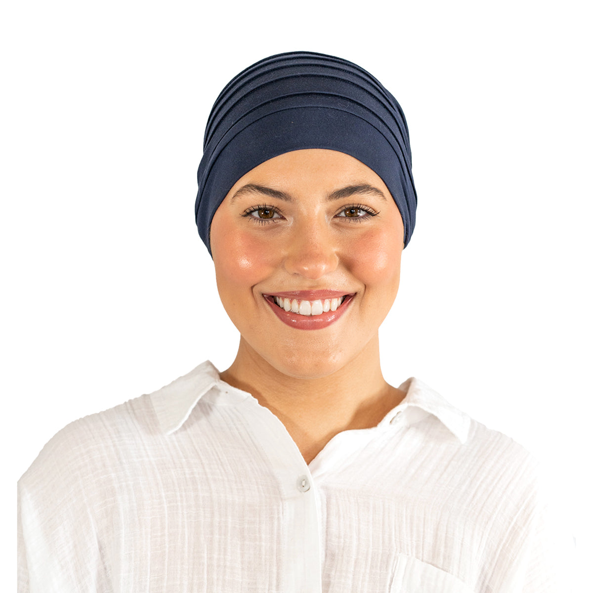 Woman wearing a navy blue headscarf and white shirt on a white background
