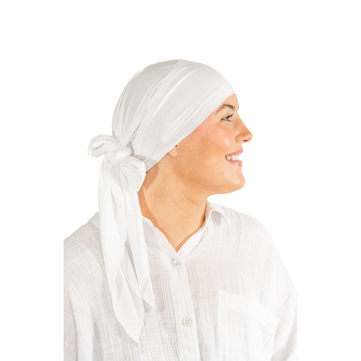 Woman wearing a white headscarf on a white background
