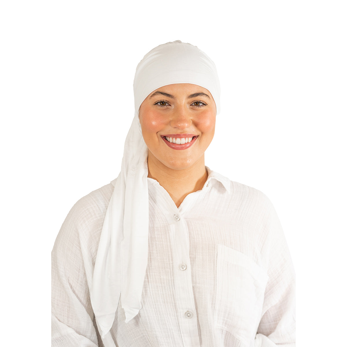 Woman wearing a white headscarf and white shirt on a white background
