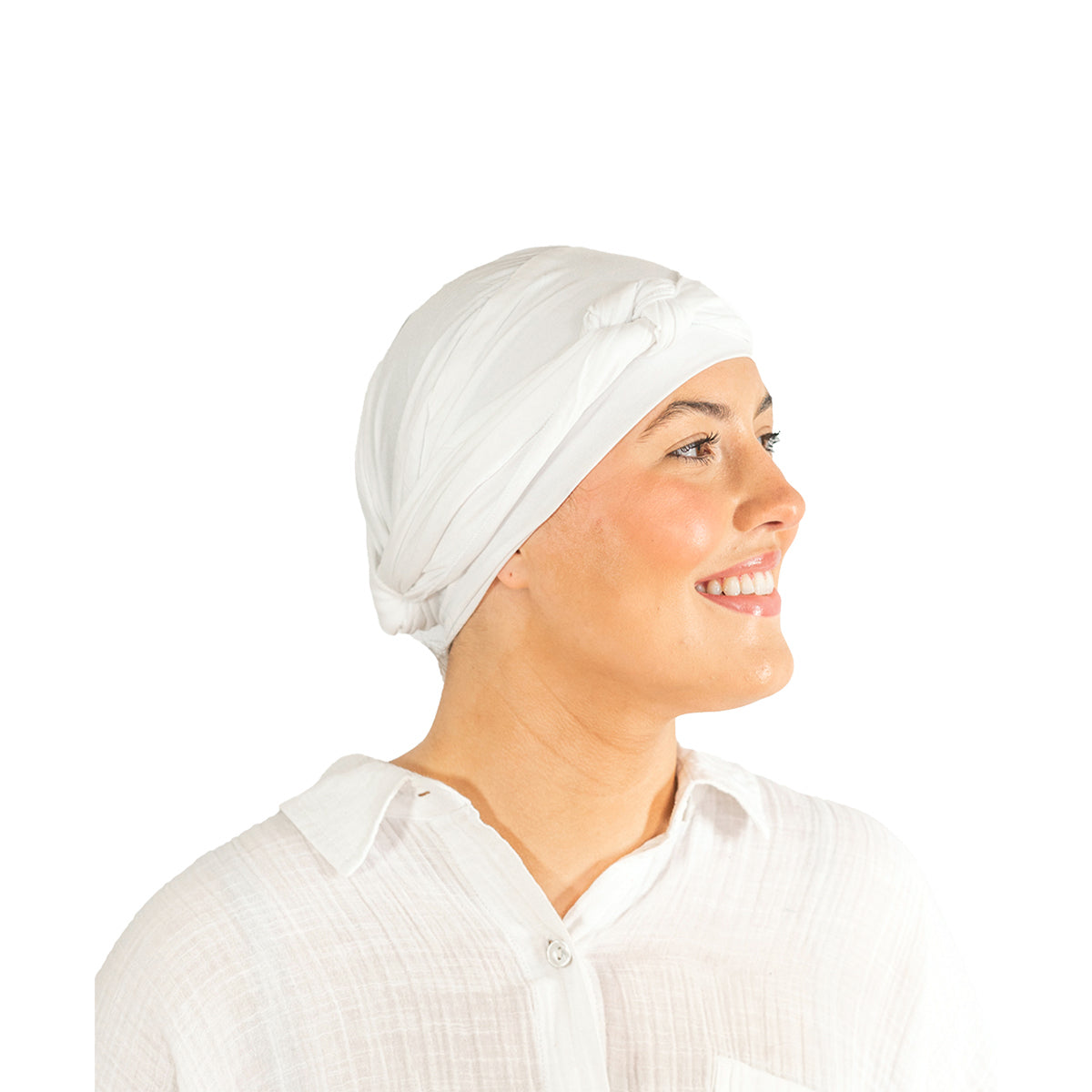 Woman wearing a white headscarf on a white background